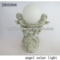 angels holding a solar light ball decoration
